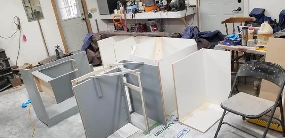A room filled with lots of boxes and a chair.