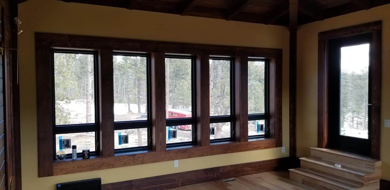 A room with a lot of windows and a door