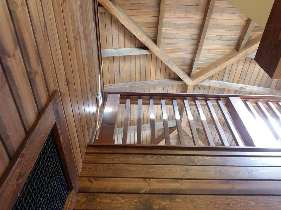 Looking up at a wooden staircase in a house