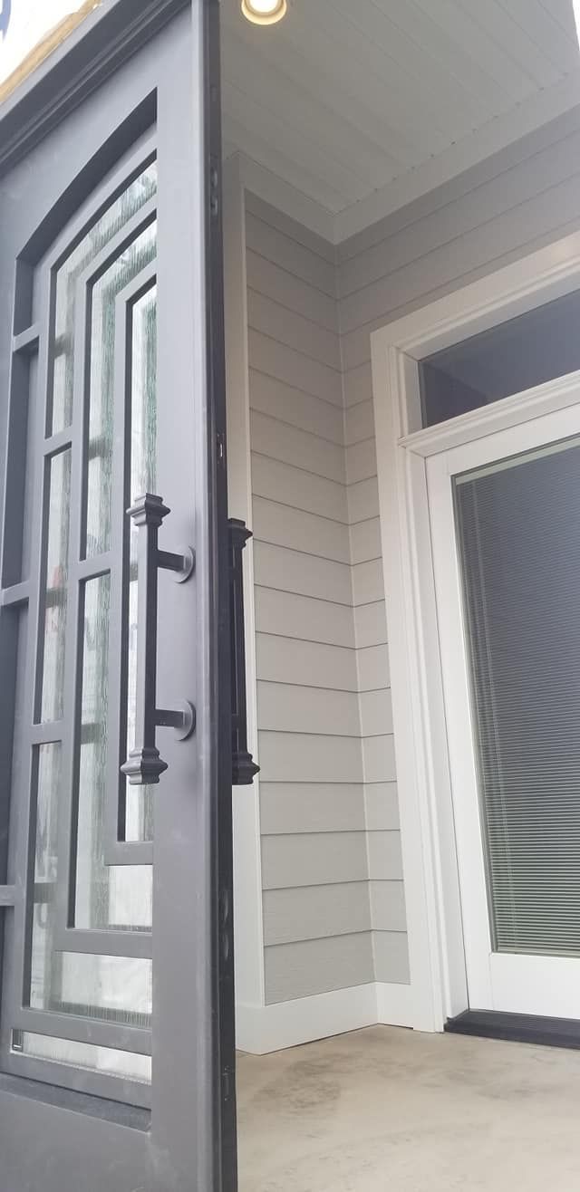 A close up of a door with a handle in a house.