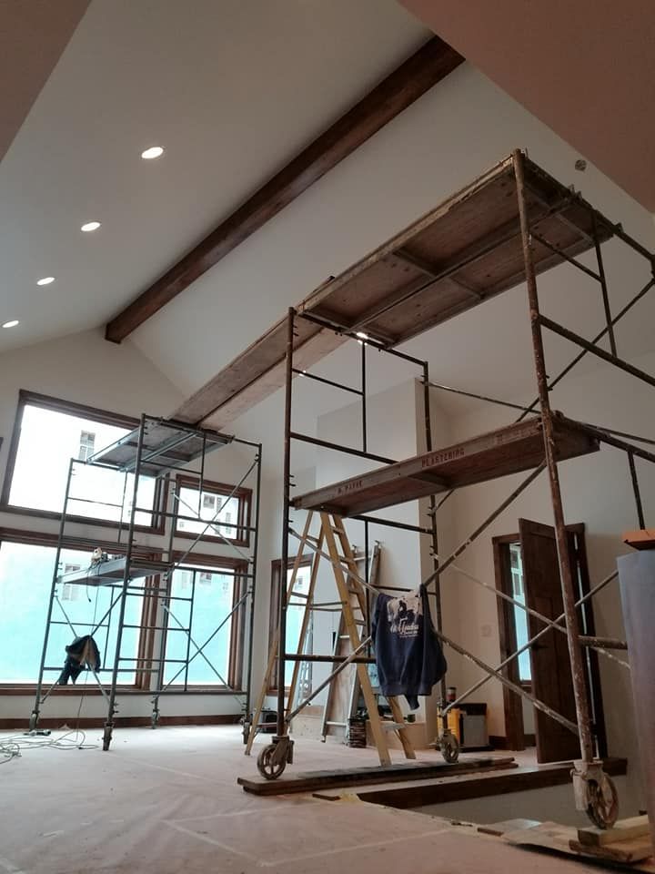 A room with scaffolding and a ladder in it
