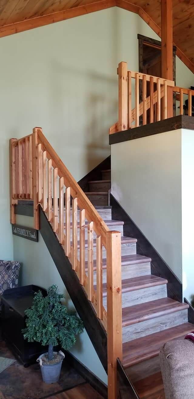 A wooden staircase leading up to the second floor of a house.