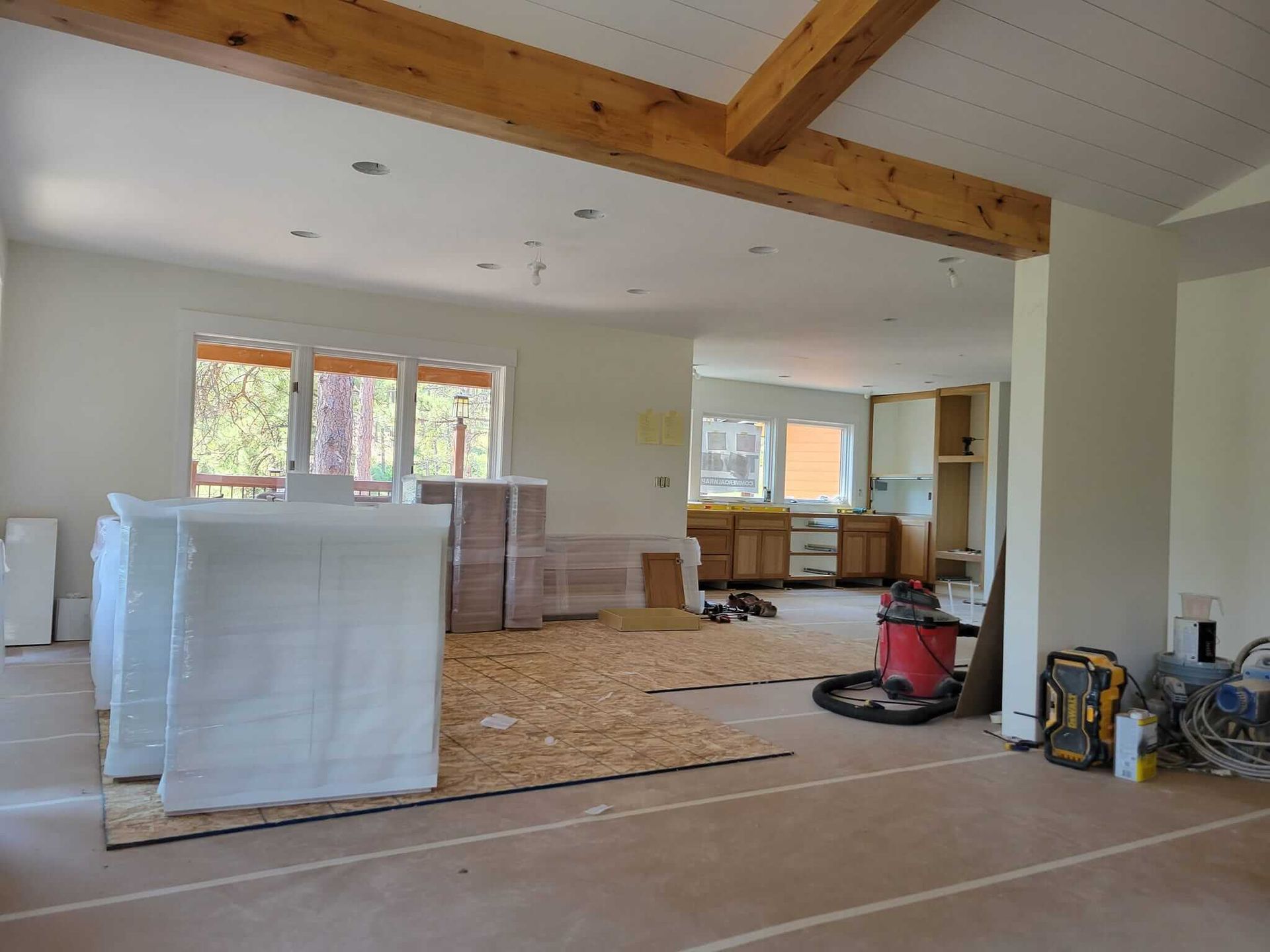 A large room with a vacuum cleaner in the middle of it.