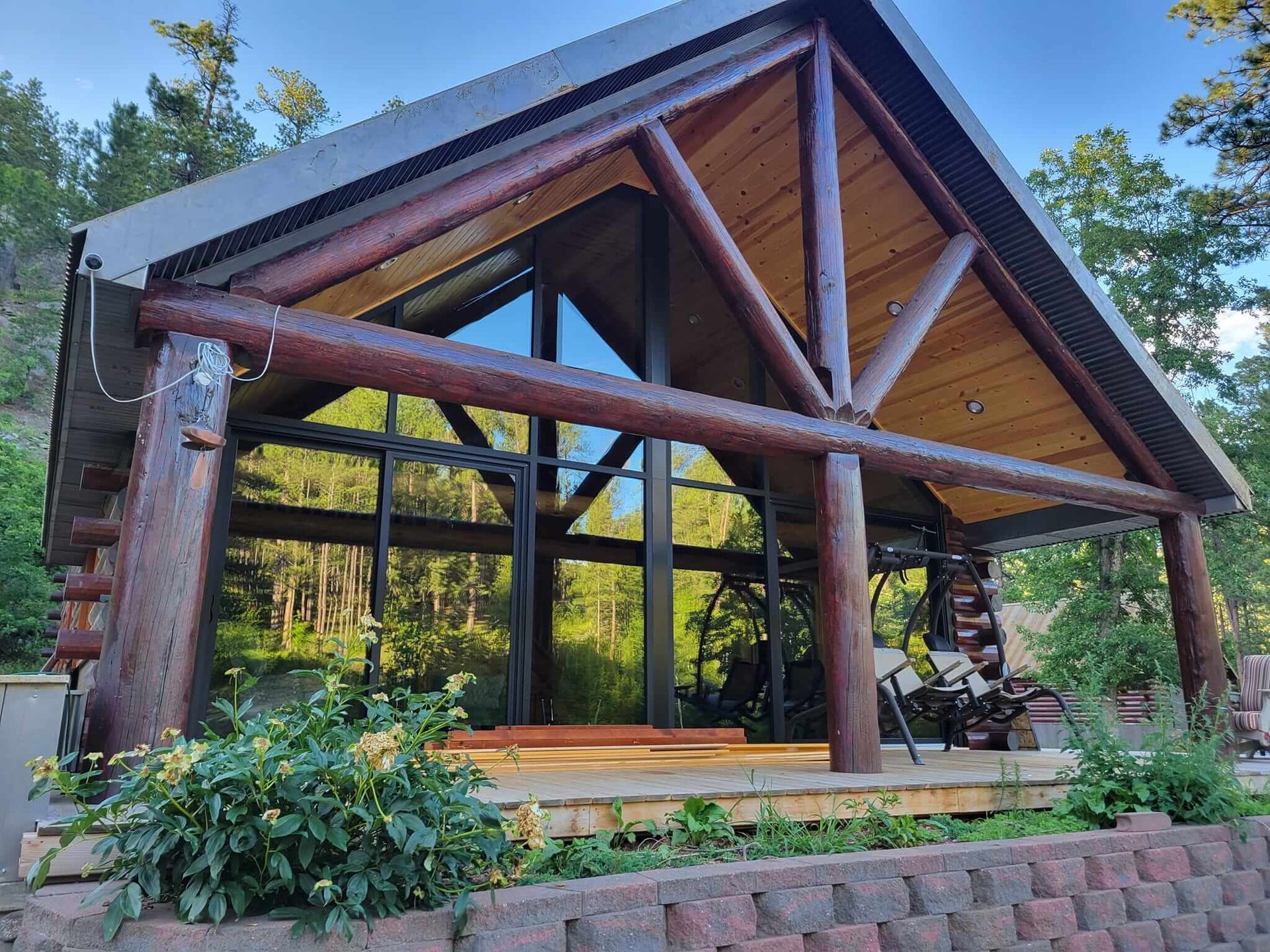 A large log cabin with a roof made of logs