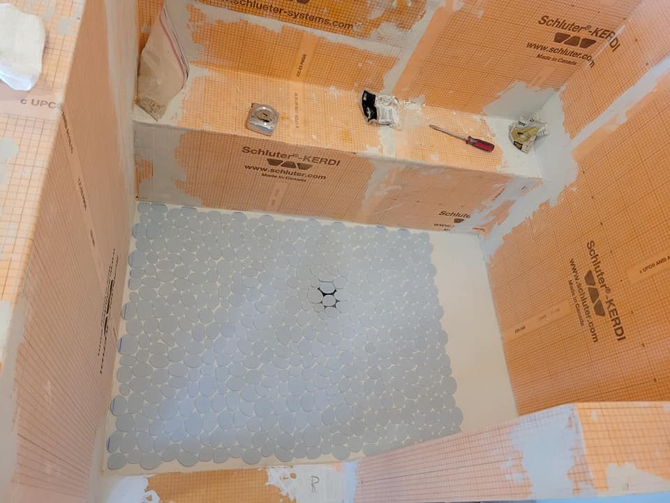 A bathtub is being remodeled with foam on the floor and walls.