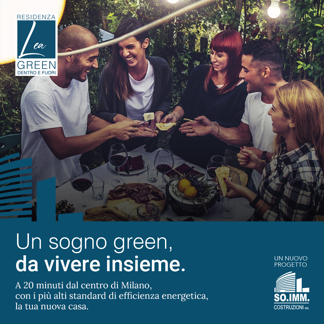 un gruppo di persone si siede attorno a un tavolo con cibo e vino