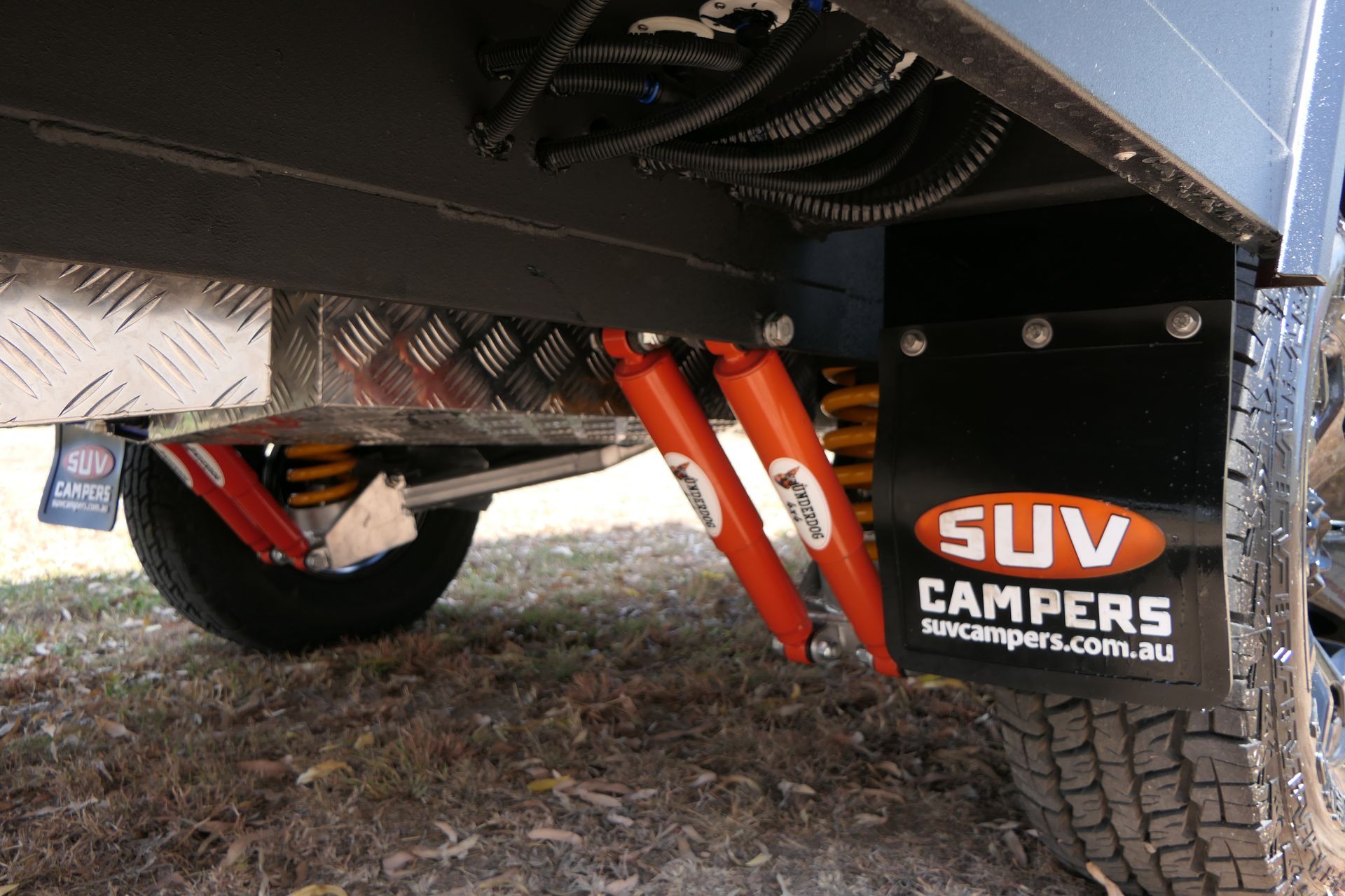 A suv with a mud flap that says suv campers on it