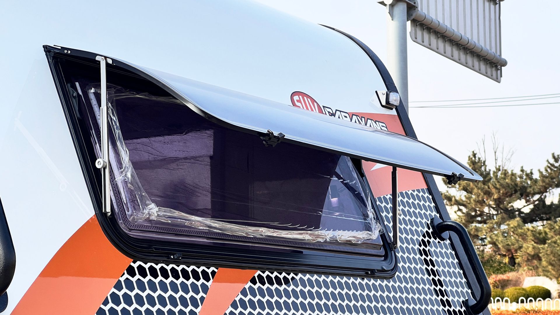 A close up of a vehicle with a broken windshield