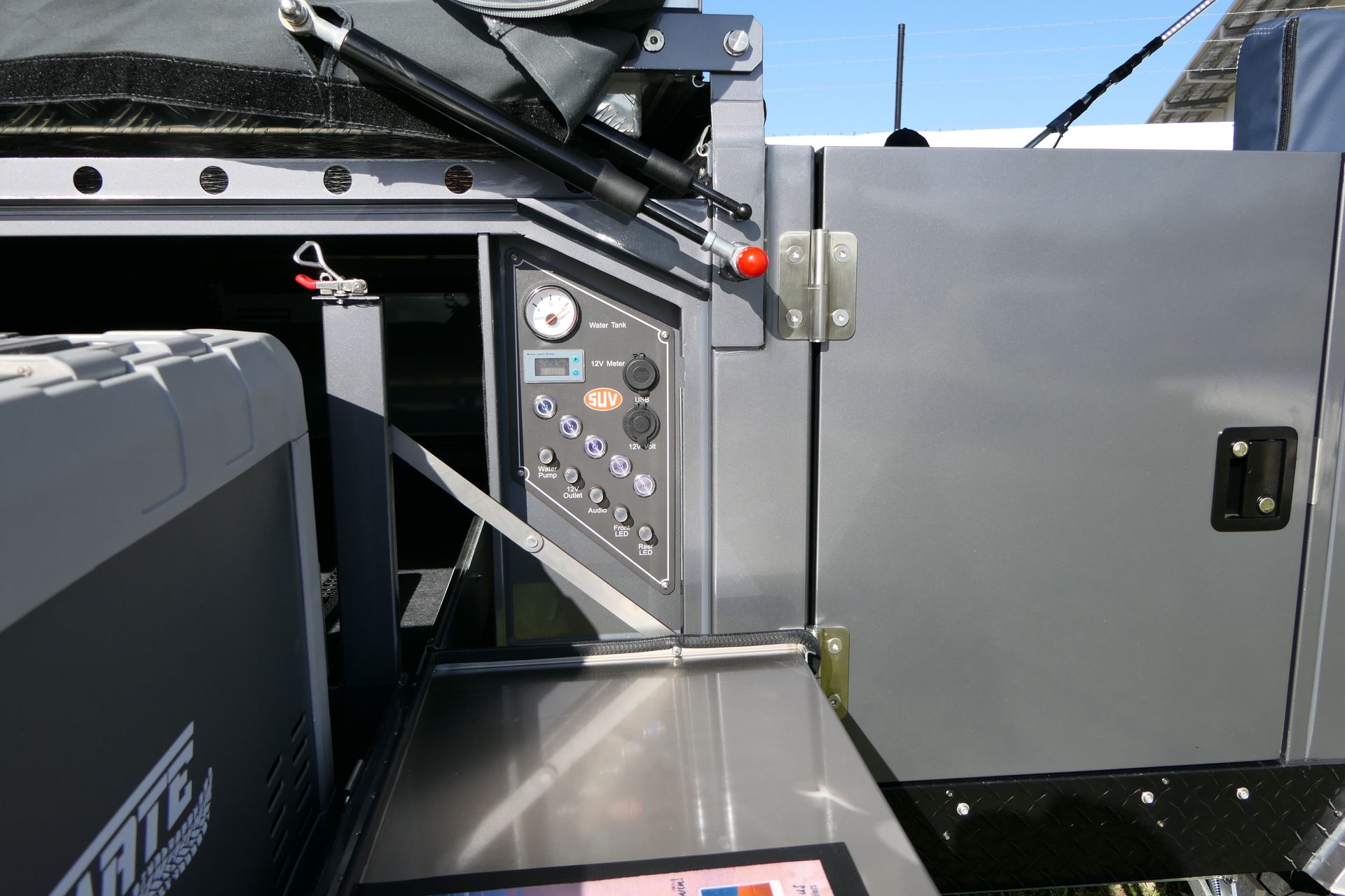 A stainless steel counter top in a vehicle with the word rite on it