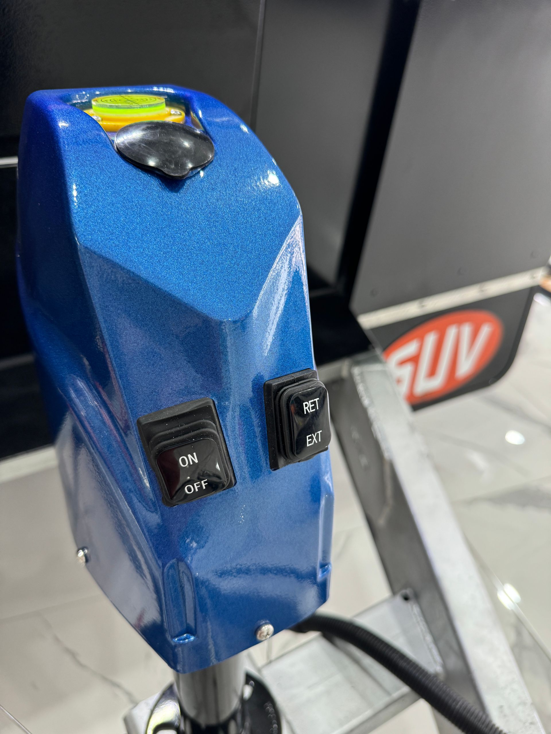 A blue device with two black switches on it