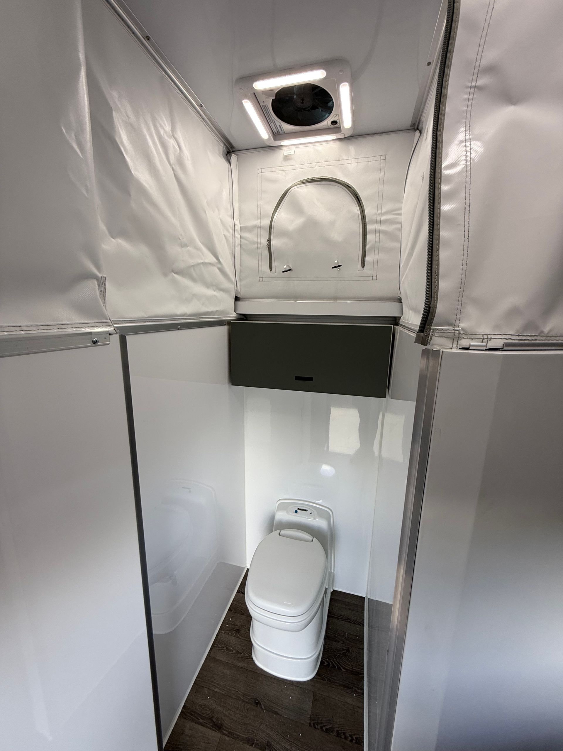 There is a toilet in the middle of the room.