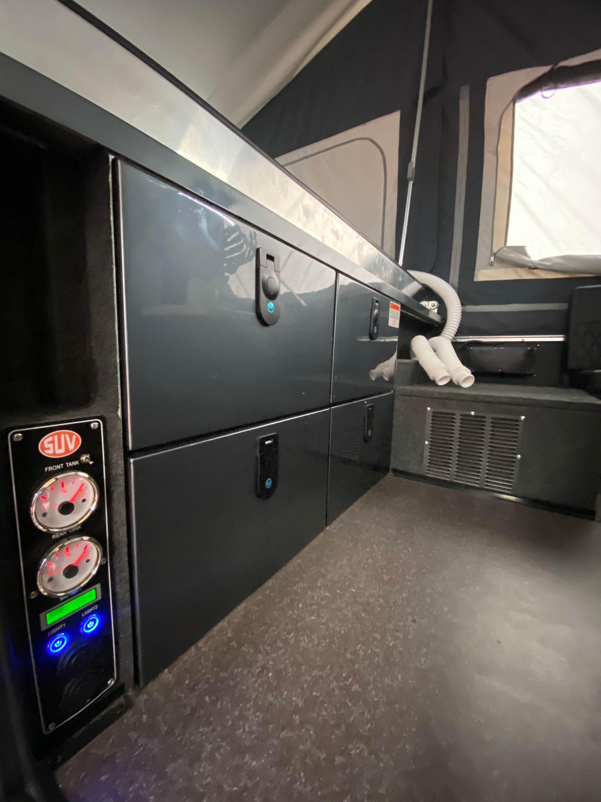 A black cabinet with a remote control on it