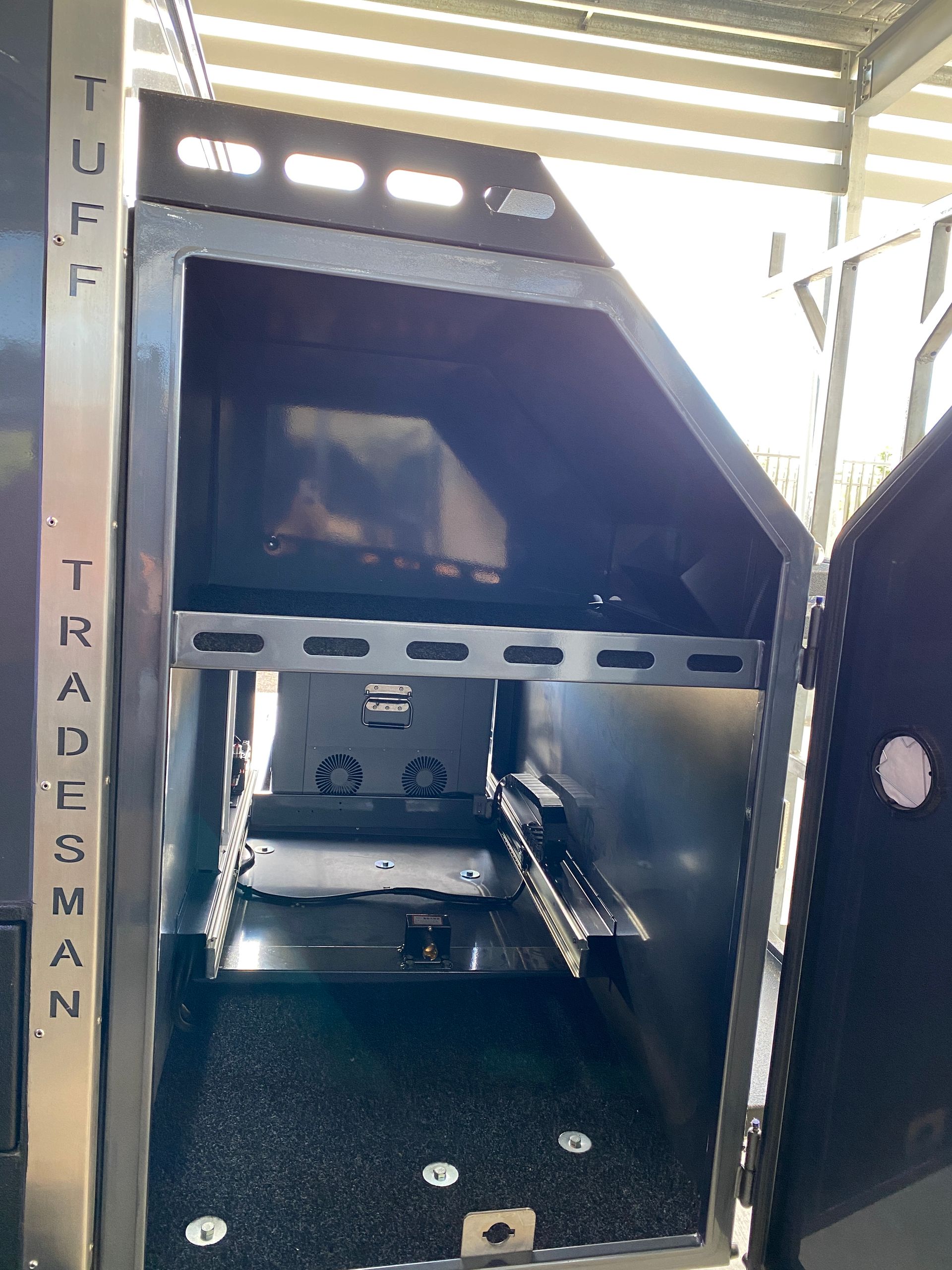 The inside of a tuff tradesman box with the door open
