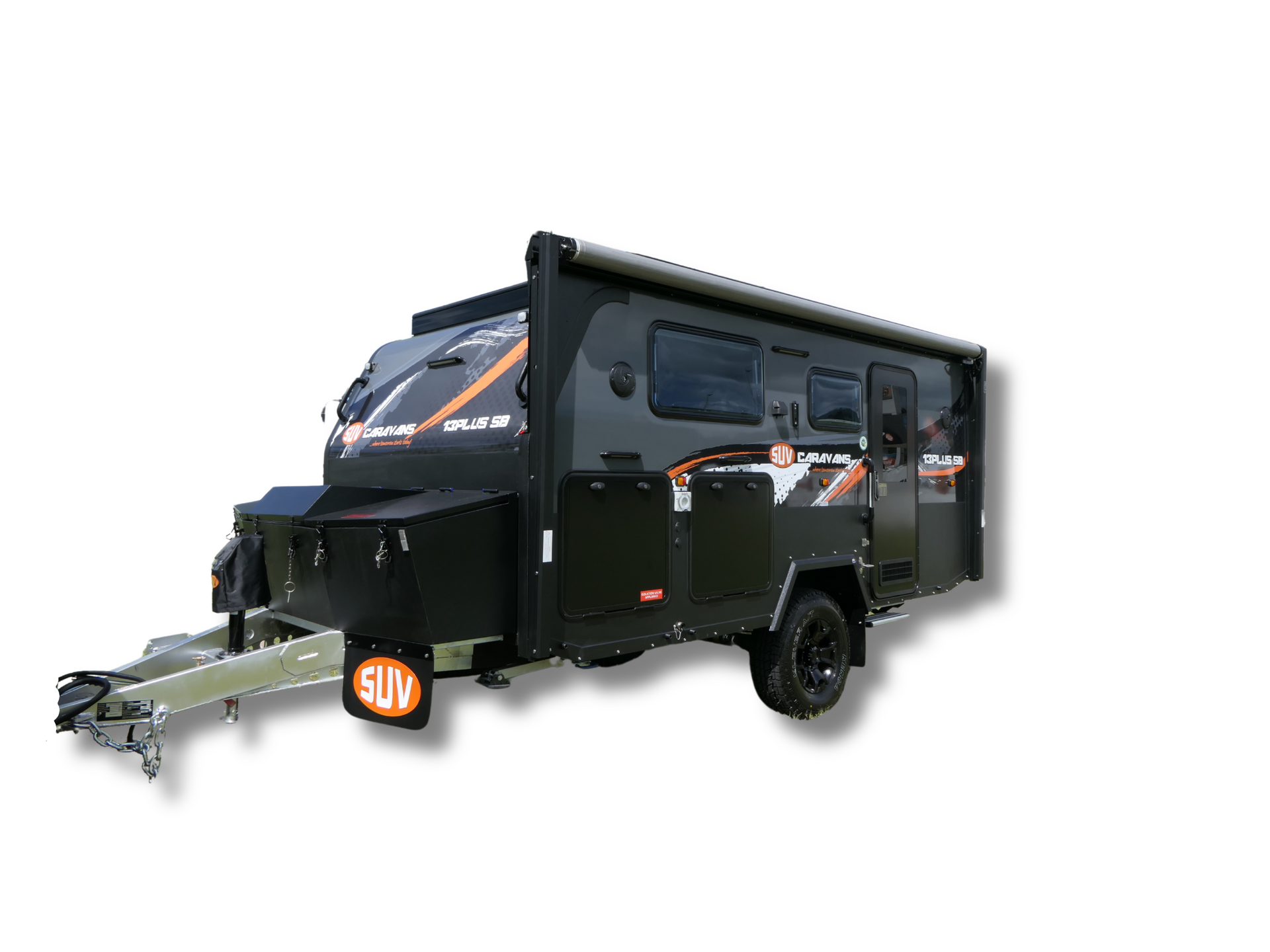 A black camper trailer is parked in a grassy field.