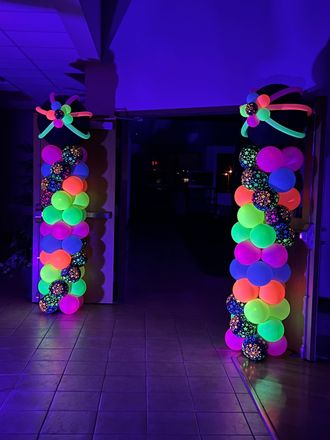 A room filled with balloons and a sign that says knights of colorado