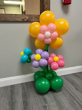 A bunch of blue and yellow balloons with numbers on them