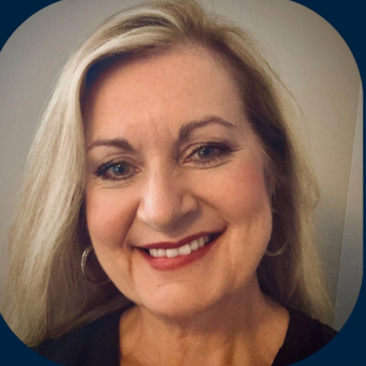 A woman with long hair and pink lipstick is wearing a black shirt.