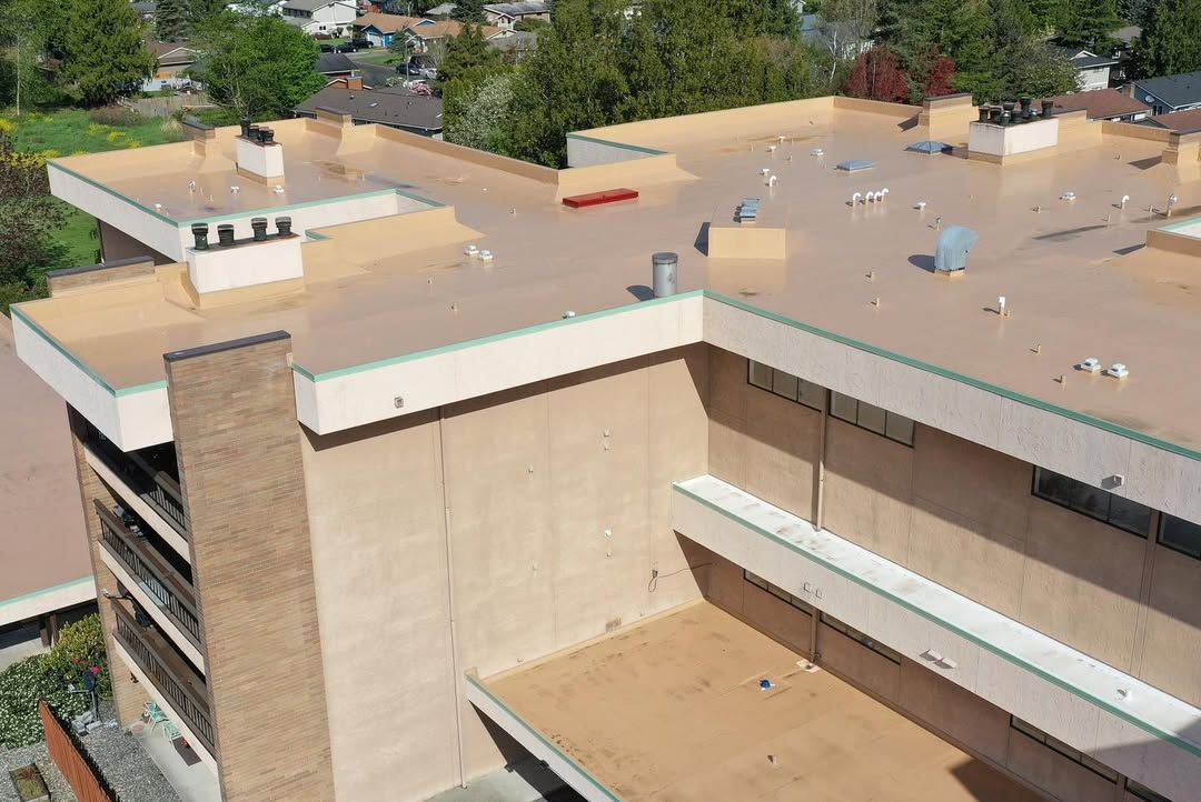 An aerial view of a building with a roof and balconies.