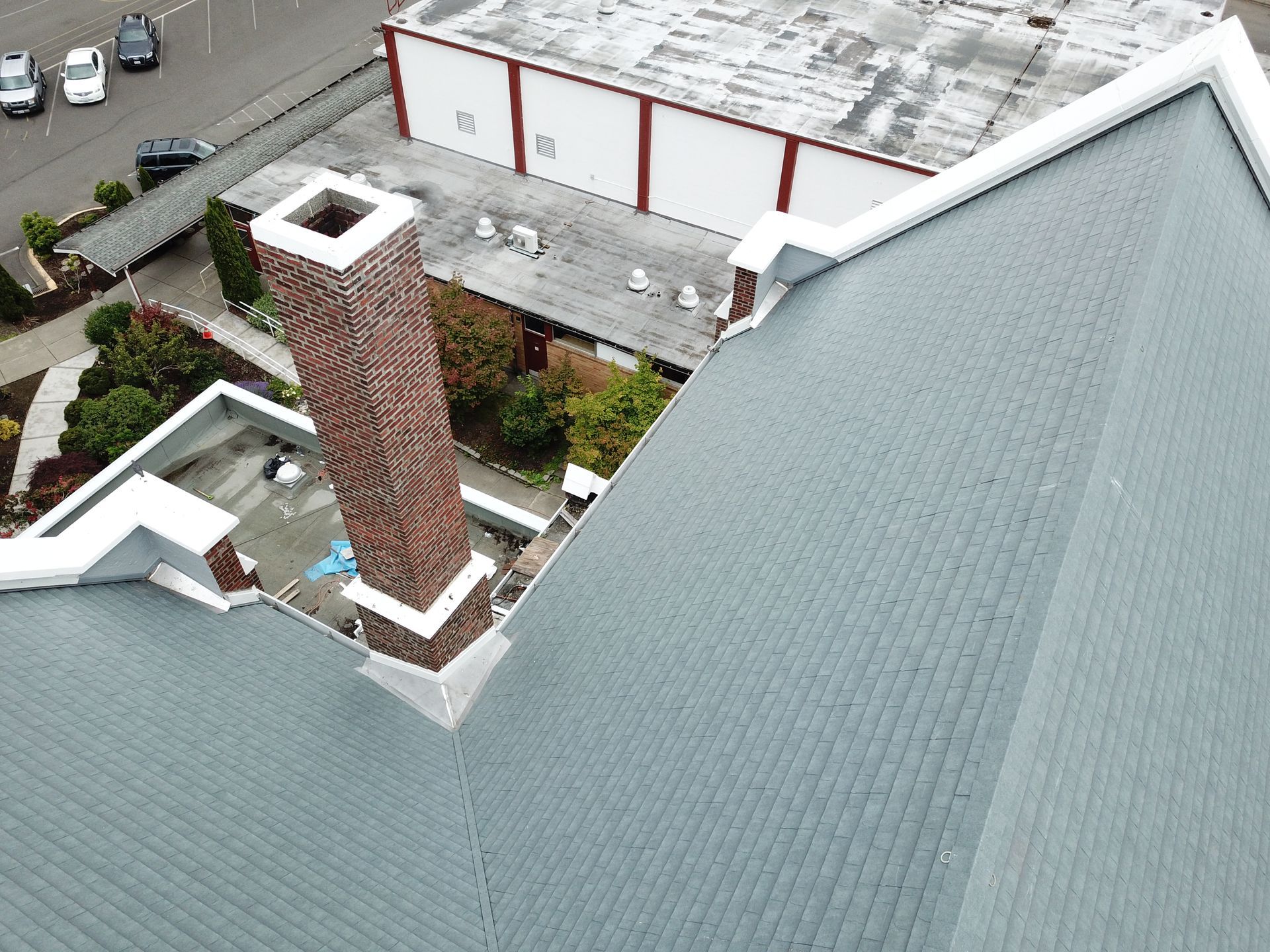 An aerial view of a roof with a chimney on it