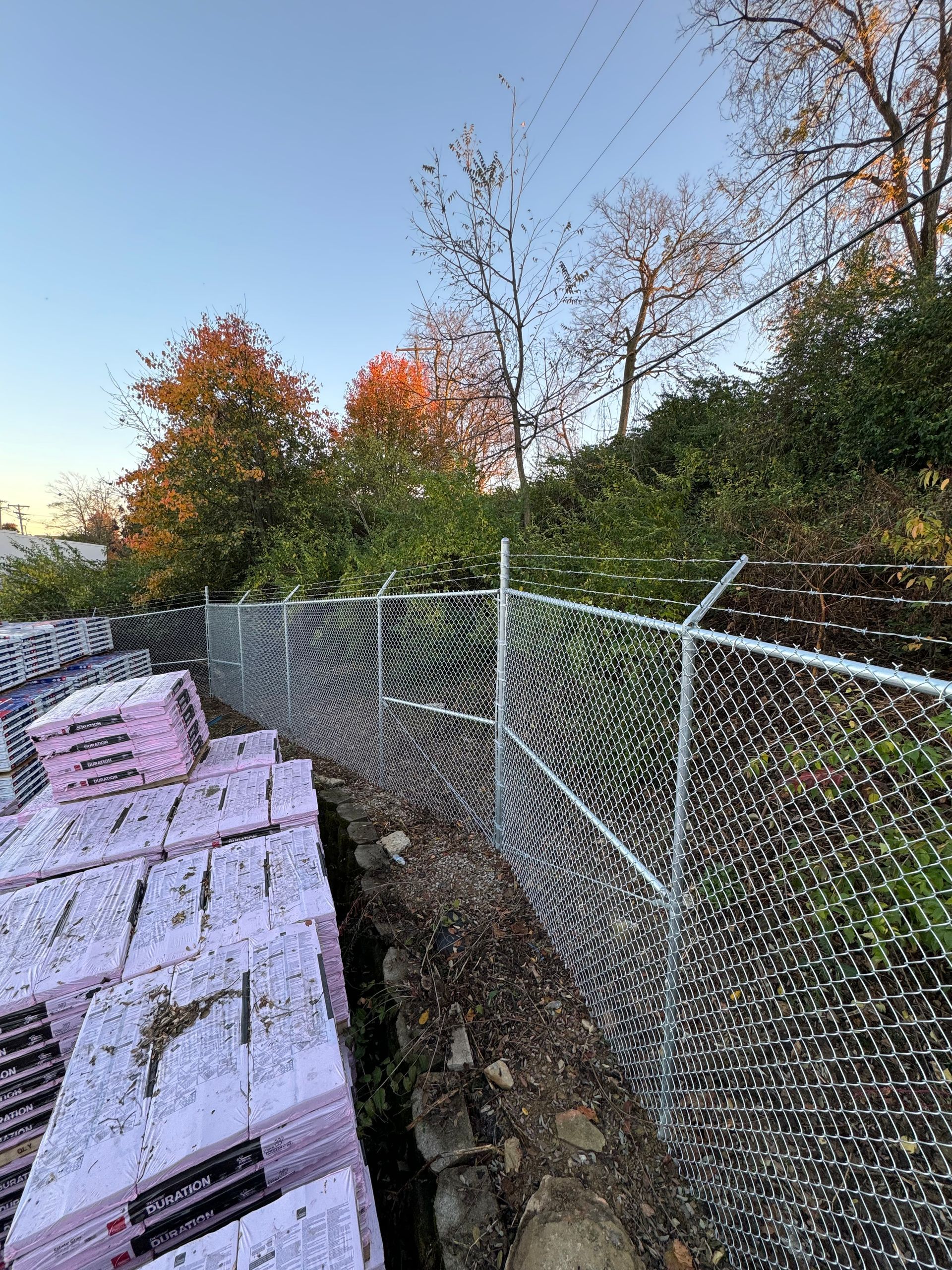 a chain link fence surrounds a pile of bricks — Lexington, KY — Chafin Fence LLC