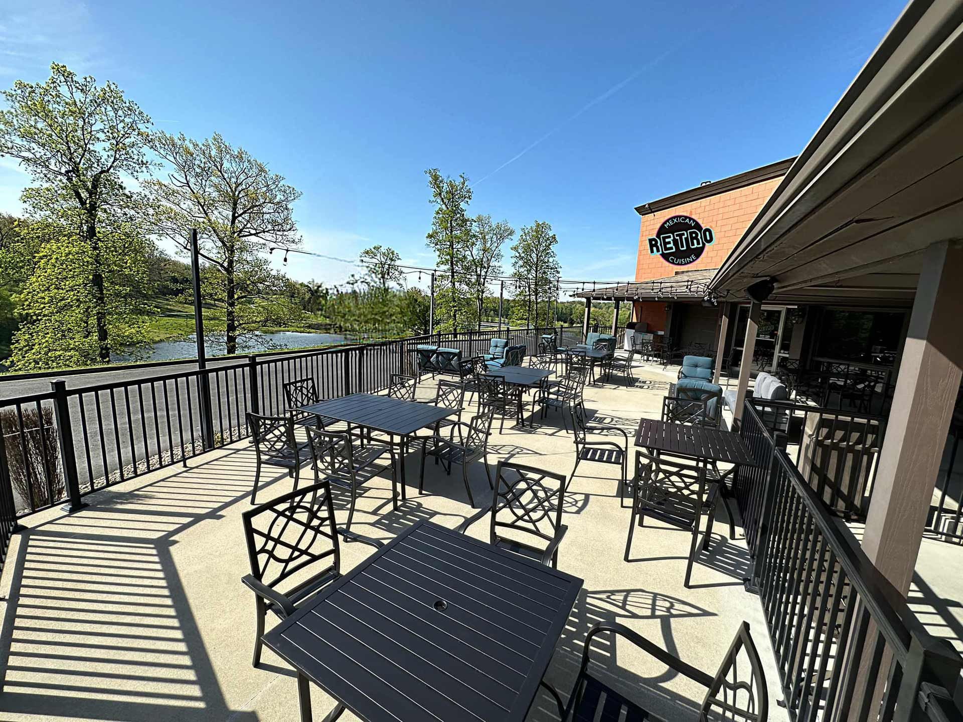 Tables and chairs on the balcony of a restaurant