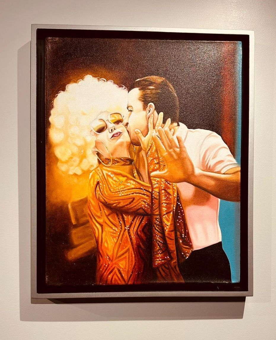 A painting of a man and a woman kissing