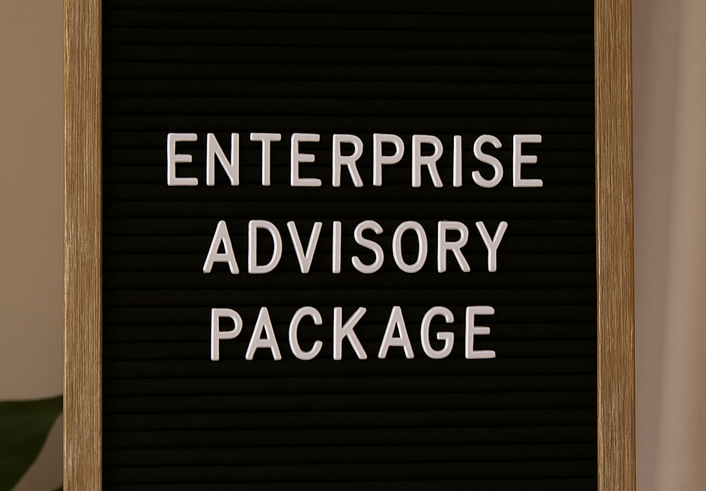 A black letter board with white letters that says enterprise advisory package
