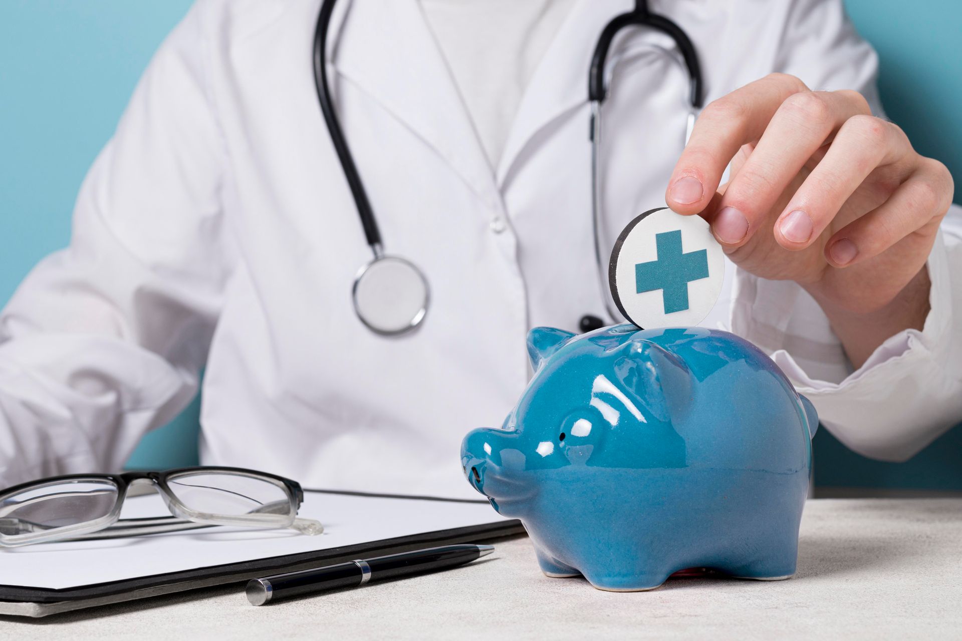 A doctor is putting a pill into a piggy bank.