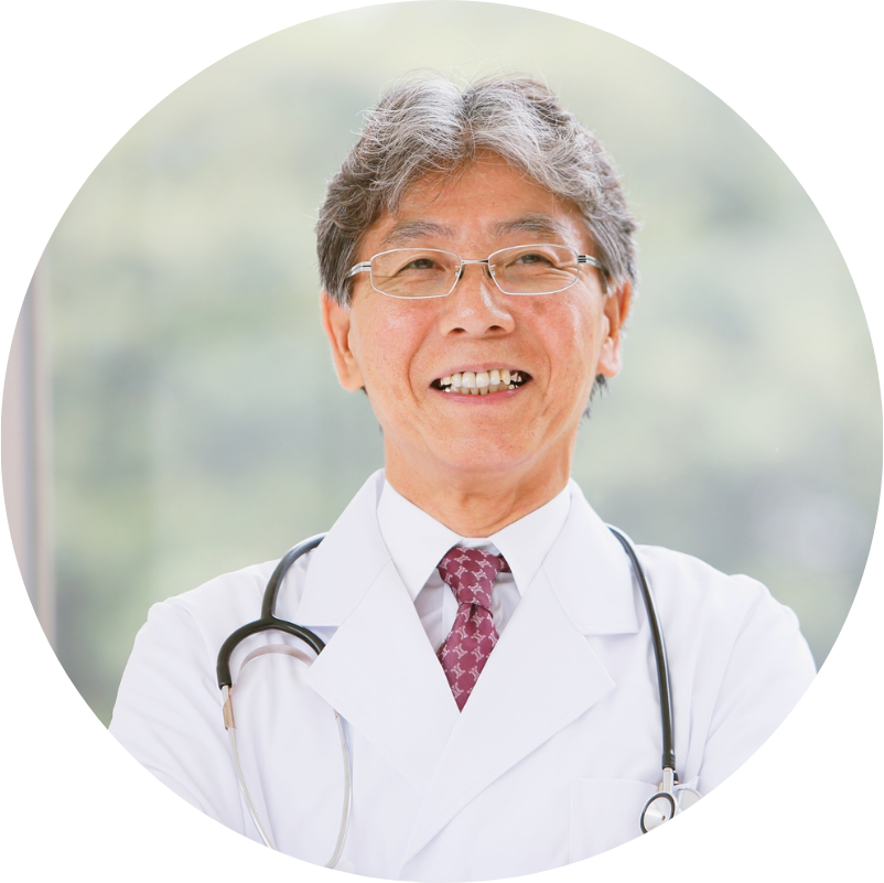Smiling Asian doctor with stethoscope, wearing glasses and white coat.
