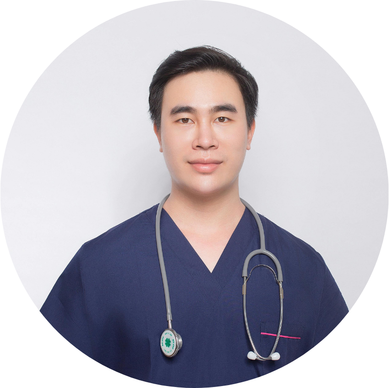 Asian male doctor in blue scrubs wearing a stethoscope, smiling at the camera.