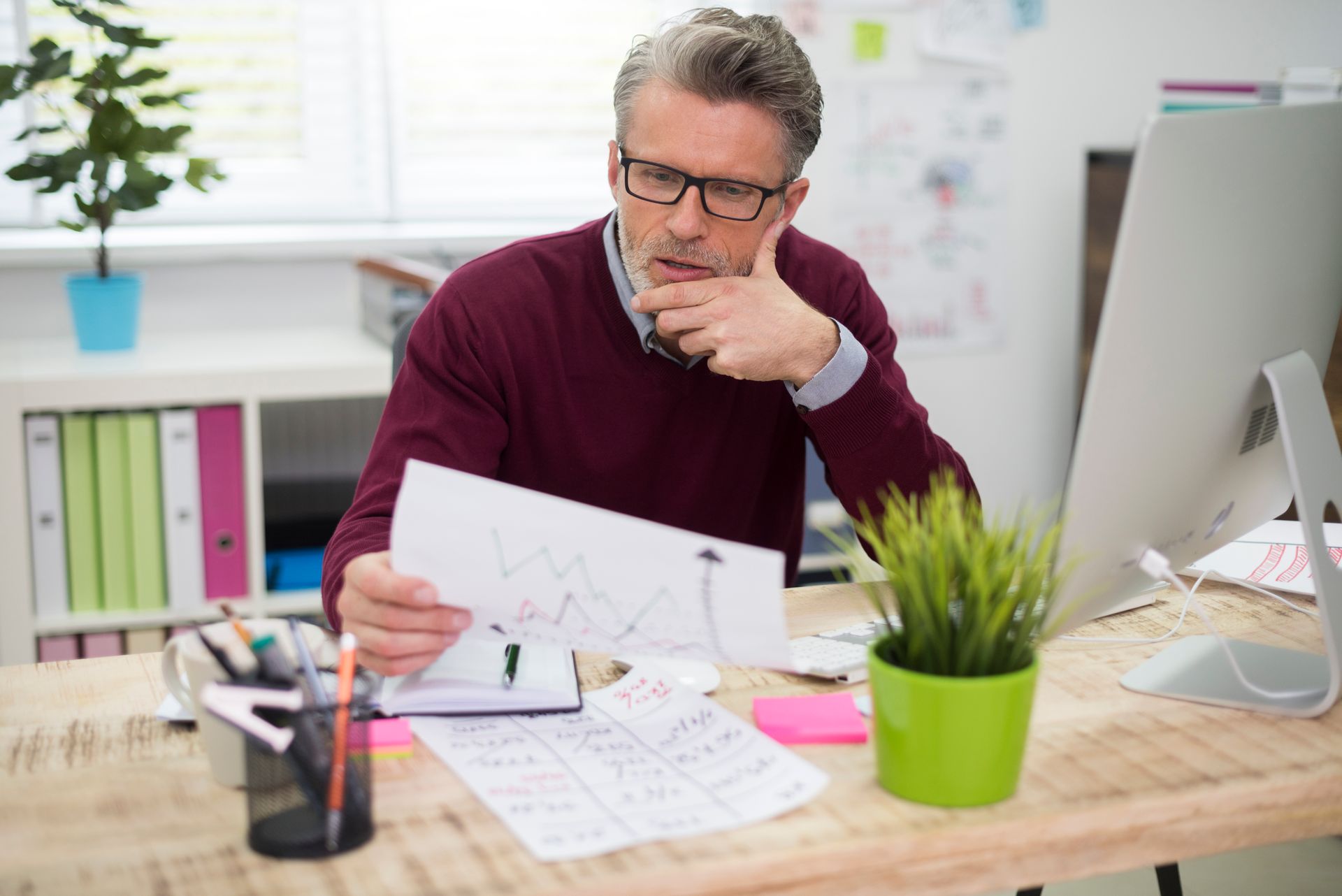 A man looking at the report sheet