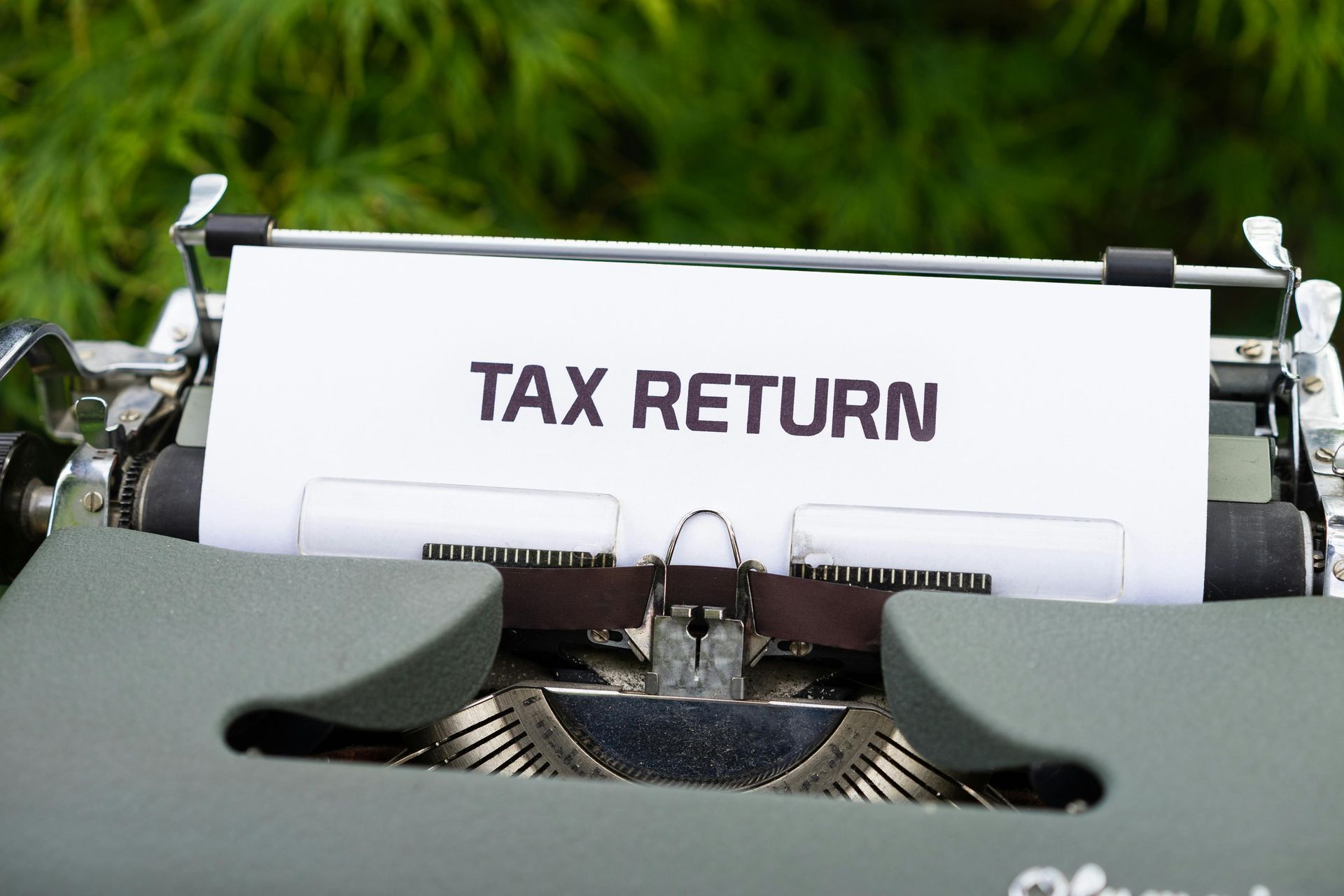 Tax return document in a typewriter with paper inserted