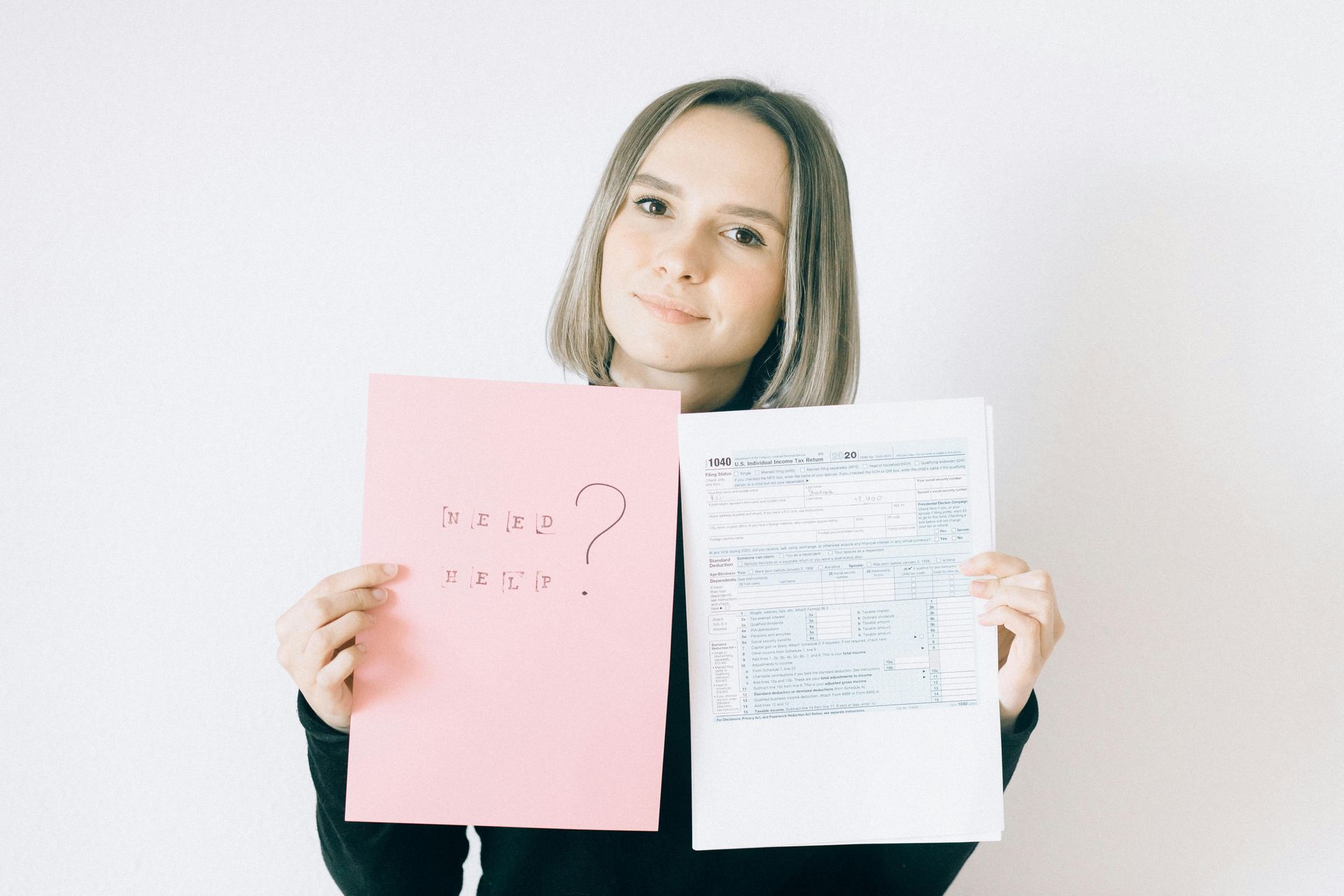 Woman holding pink paper with 