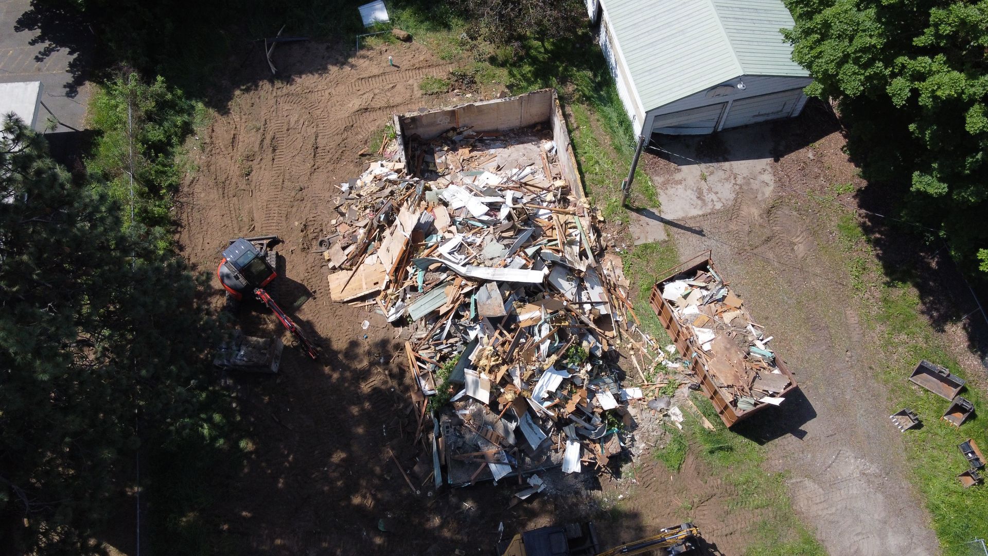 An aerial view of a pile of trash in a yard.