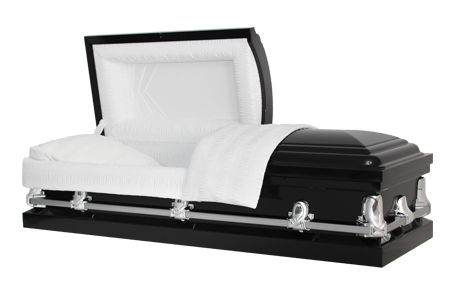 a black coffin with the lid open and a white blanket on it