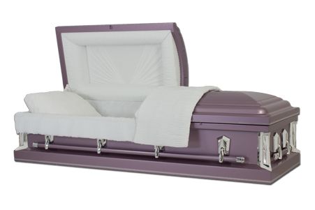 a purple coffin with the lid open and a white blanket on it .