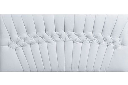 a close up of a white leather headboard on a white background .