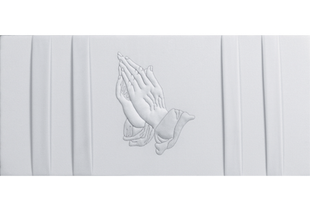 a white wall with a praying hands embroidered on it .