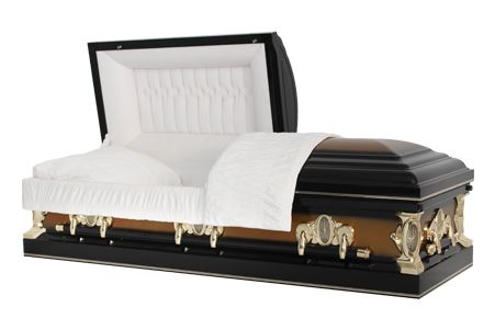 a black and gold coffin with the lid open