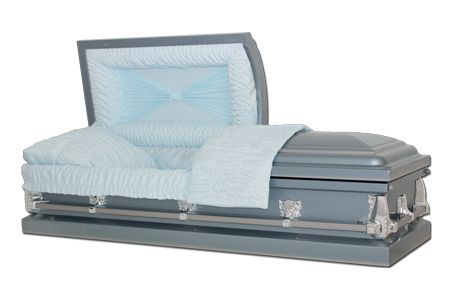 a grey coffin with a light blue blanket on it