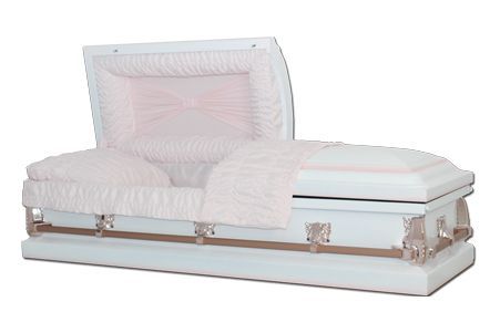 a white coffin with a pink blanket on it