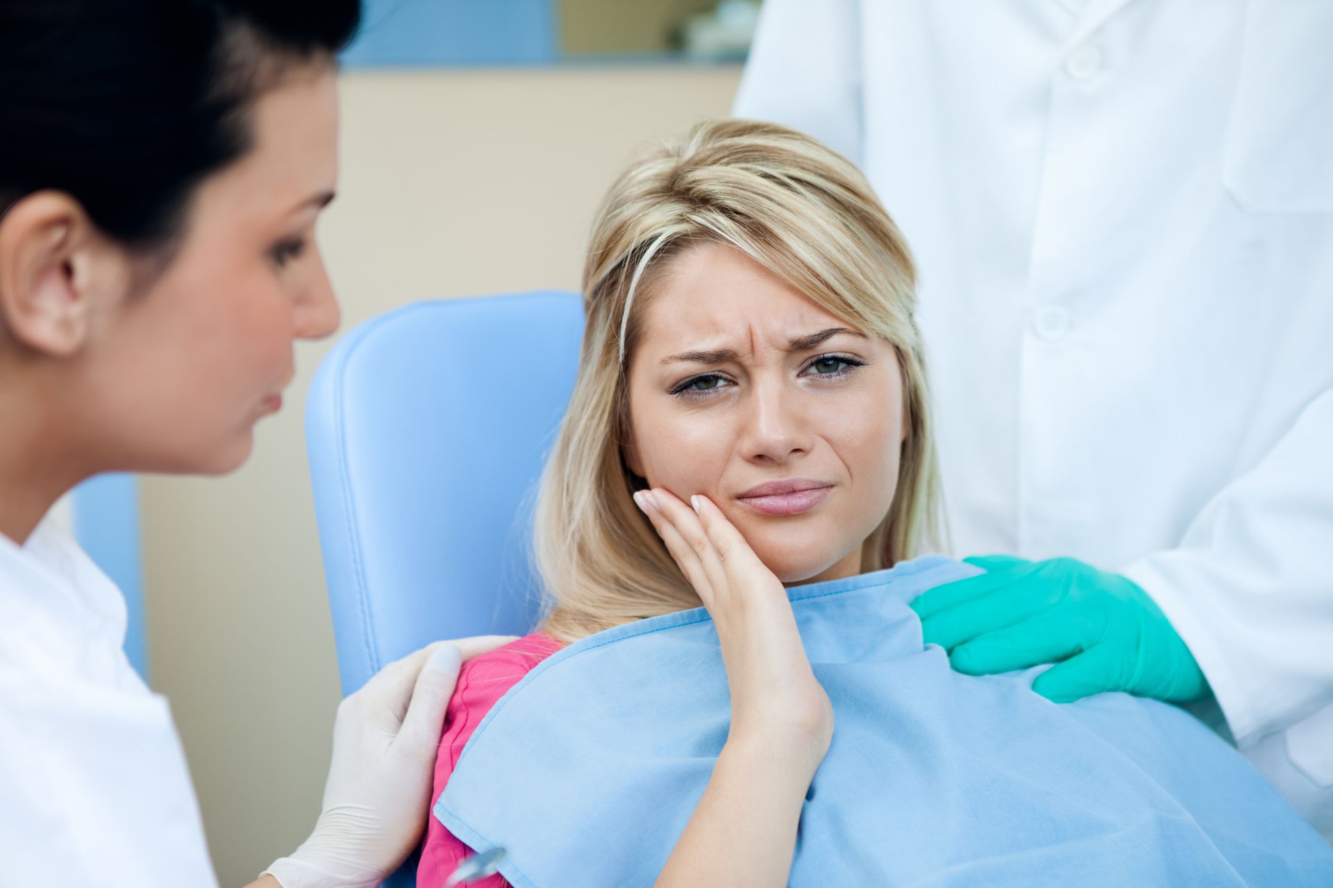 A woman is sitting in a dental chair with a toothache — Hobart, TAS — Moonah Dental Centre