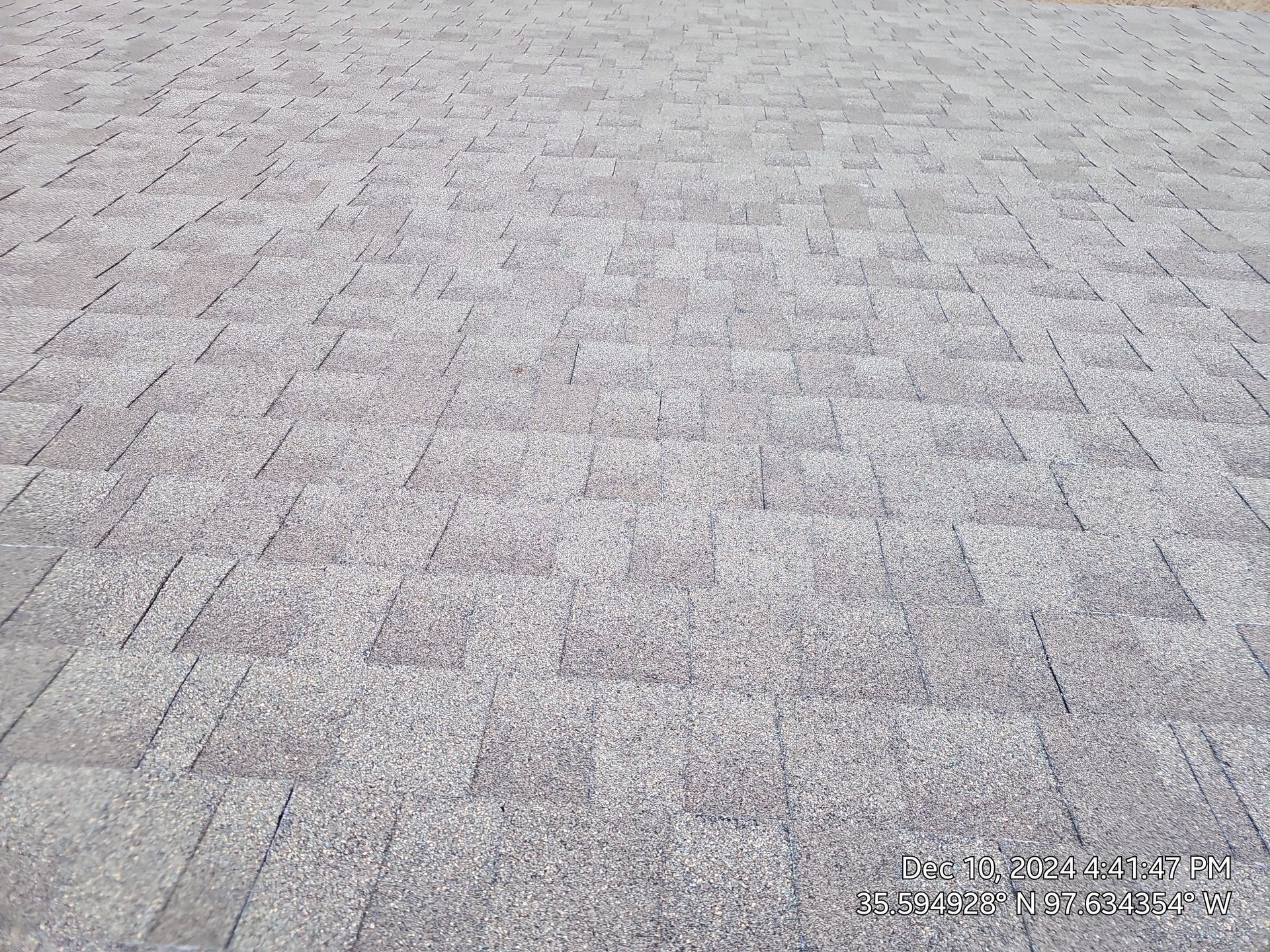 A close up of a brick pavement with a lot of bricks on it.