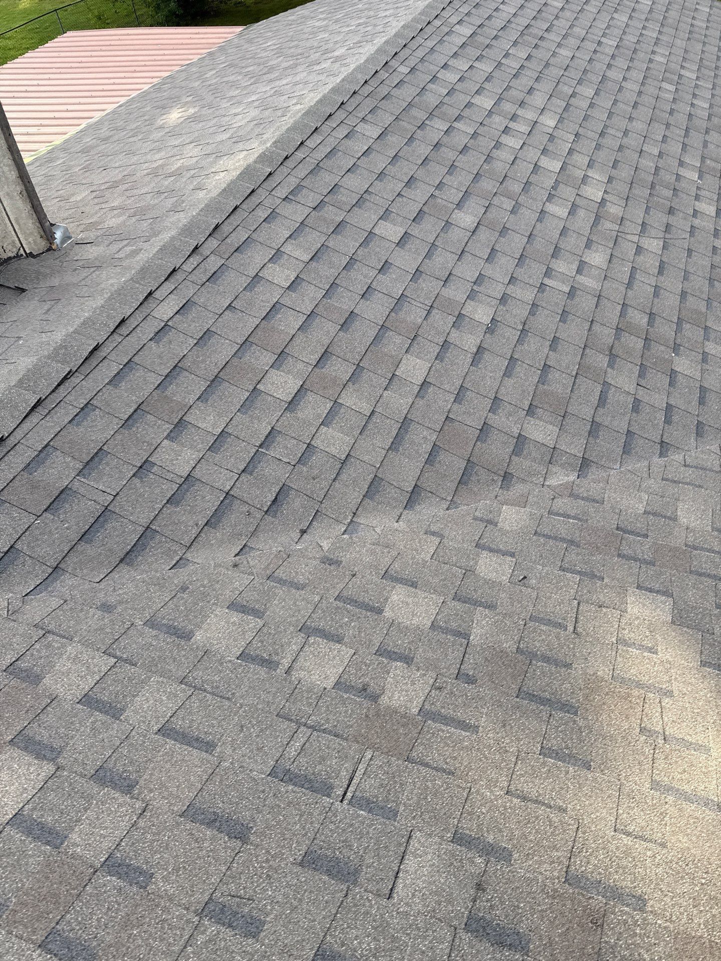 A close up of a roof with shingles on it.