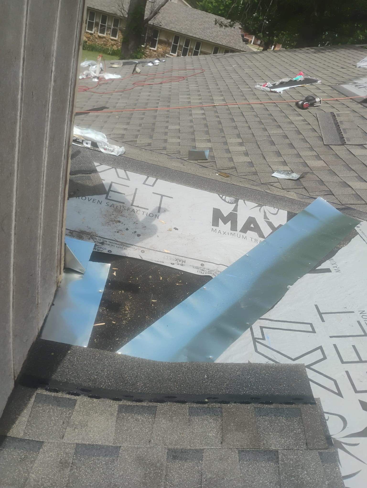 A close up of a roof with a piece of paper that says max on it