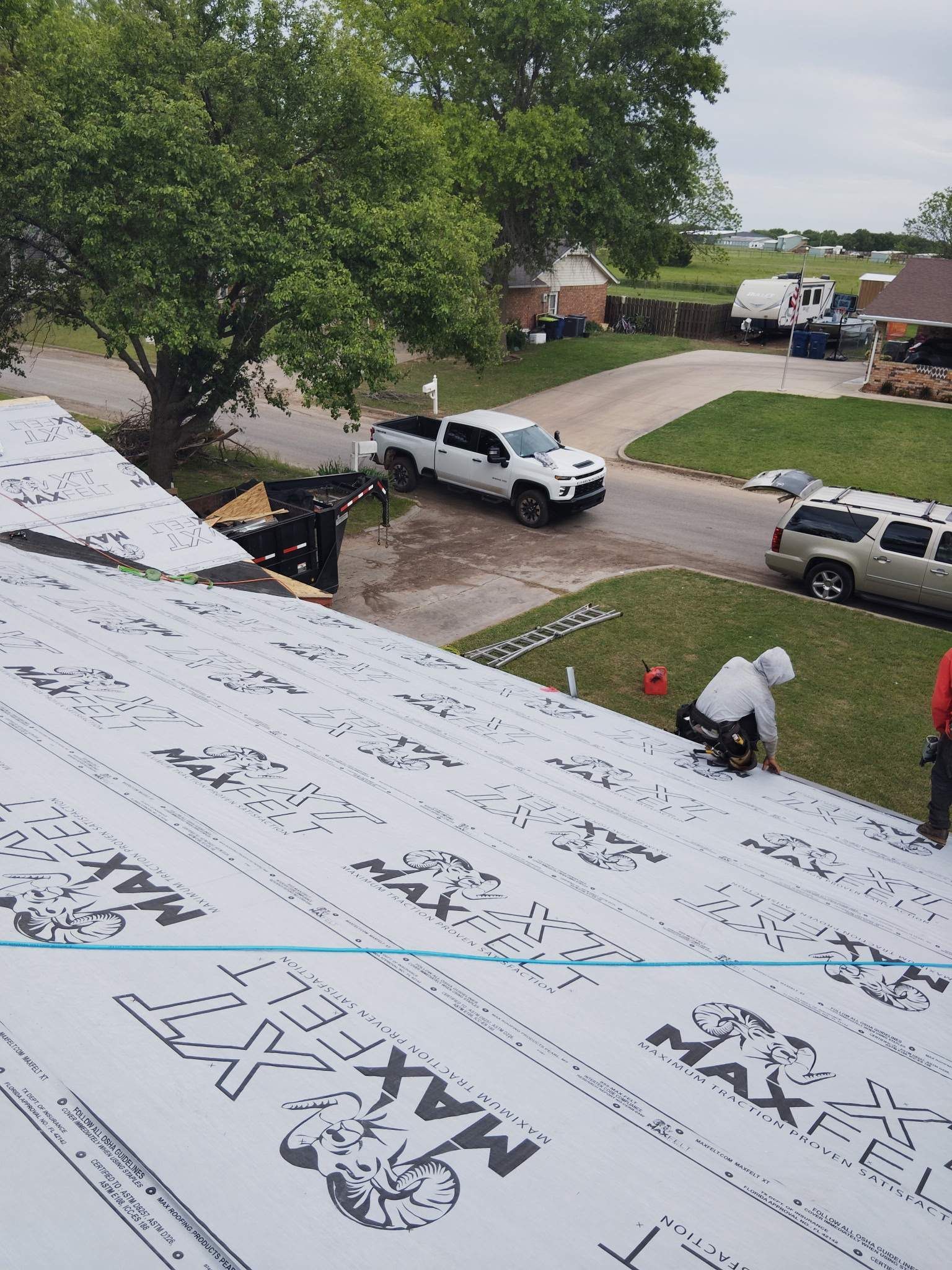 A group of people are working on a roof.