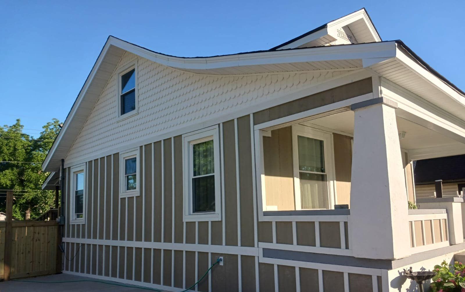 A house with a porch and a lot of windows