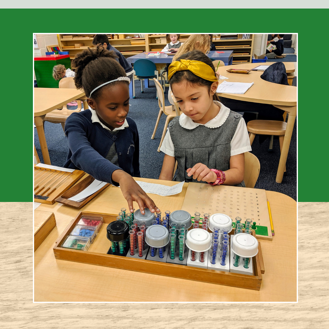 two Montessori children are sitting at a table playing with toys