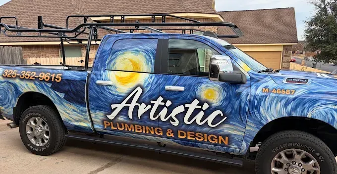 Wrapped pickup truck with “Artistic Plumbing & Design” graphics and blue-orange swirl design