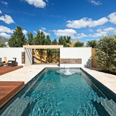 A large swimming pool with a fountain in the middle — Azure Pools Mid North Coast In Taree, NSW